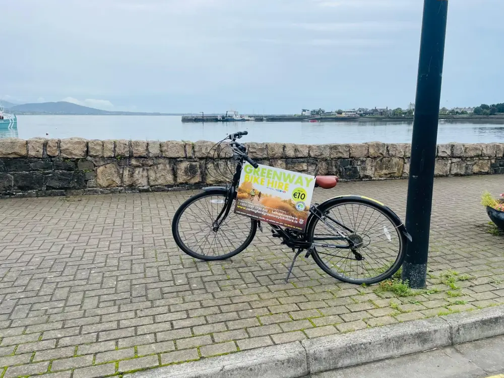 Scenic view of the Lap of the Lough cycling route with lush landscapes and clear waters